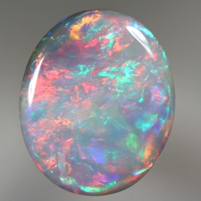 SOLID SEMI BLACK OPAL Rolling flashes of red over green and blue. SEE VIDEO